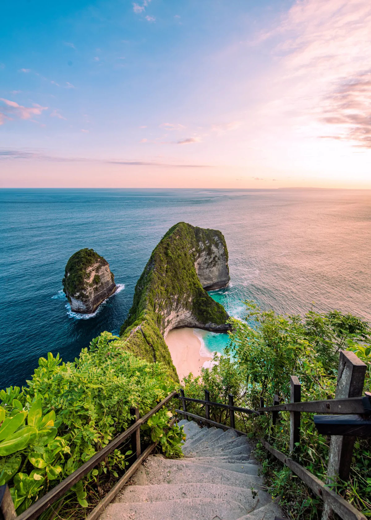 Kelingking Beach on Nusa Penida, Bali, with the famous limestone cliffs and turquoise cove at sunset