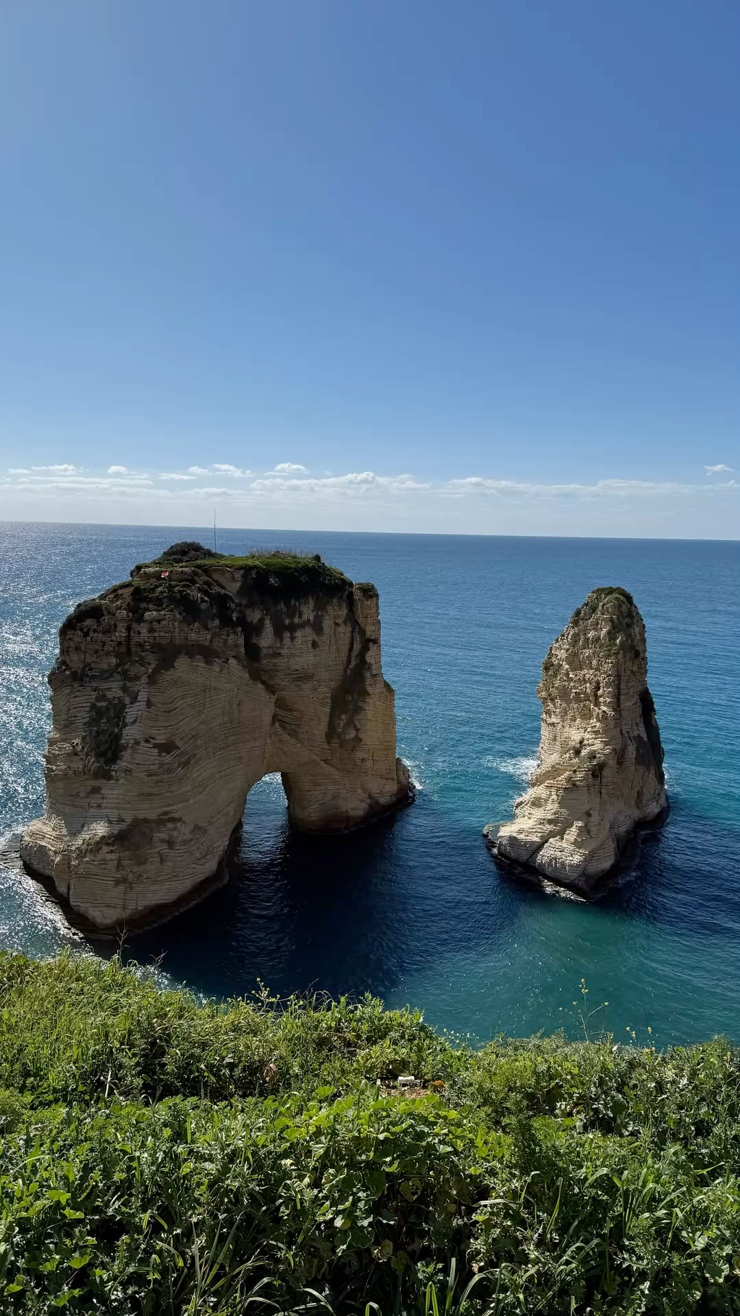 The iconic Raouche Rocks rising from the Mediterranean Sea in Beirut, Lebanon